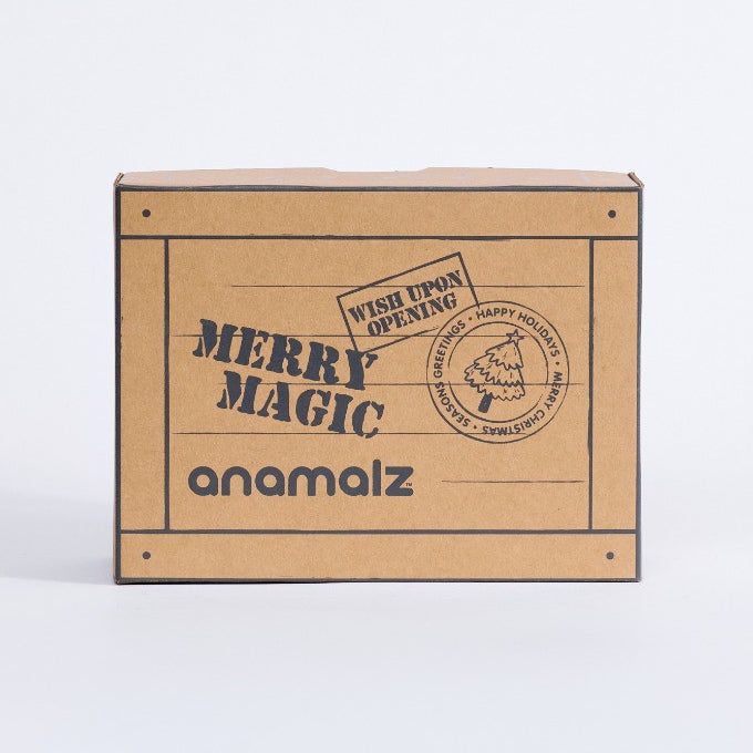 Front panel of the anamalz Christmas gift box with Merry Magic lettering and North Pole stamp