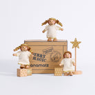 Three Cherub Angels arranged around their Merry Magic gift box with a gold star stand and wooden present blocks