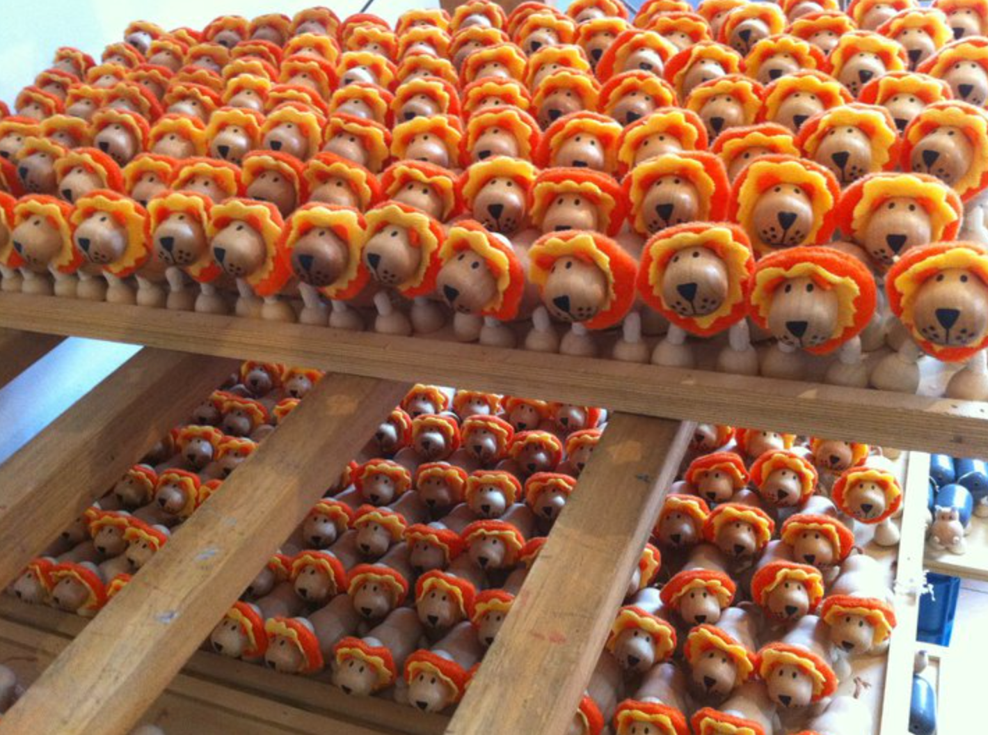 multiply rows of wooden lion toys
