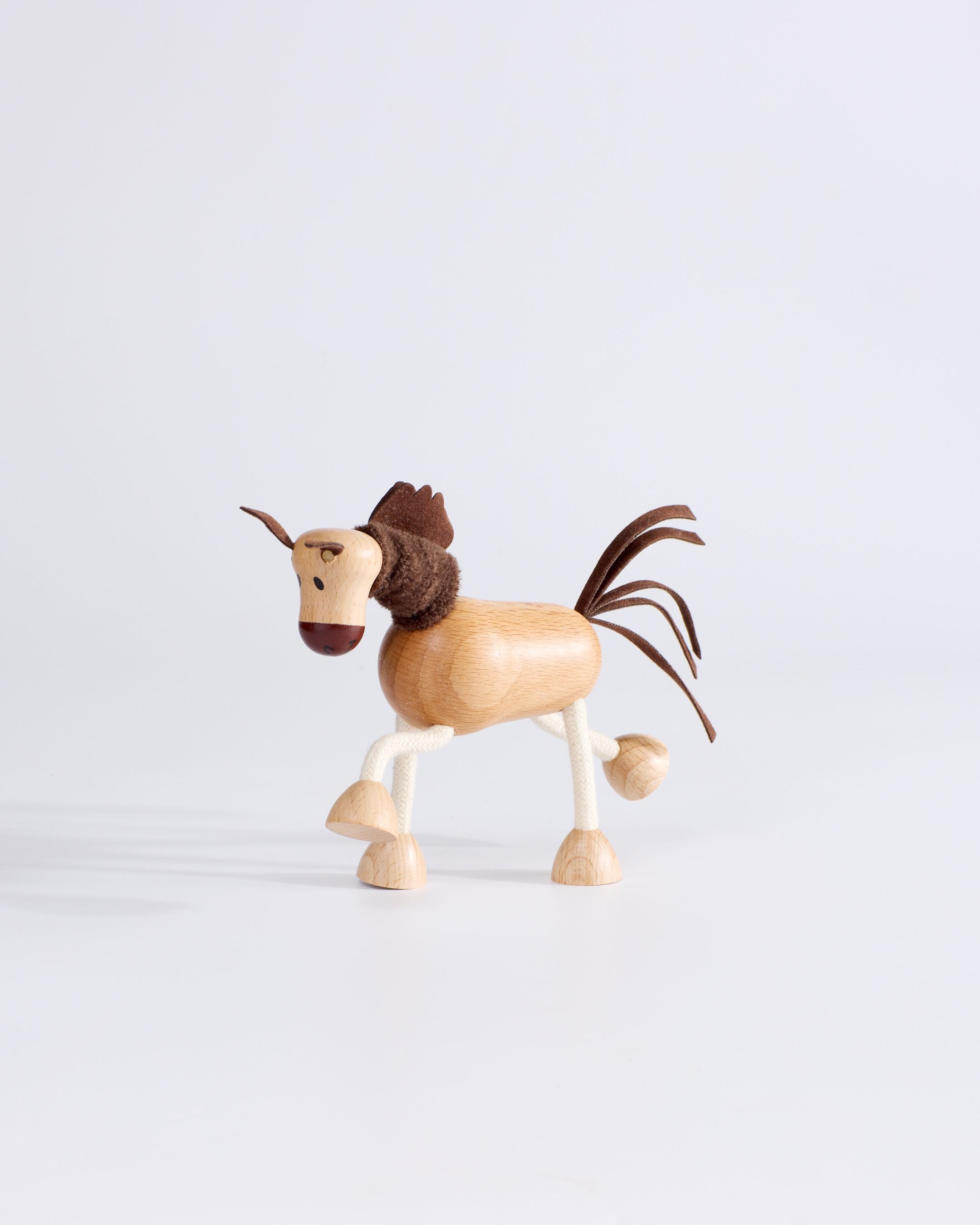 Side profile of Anamalz Wooden Horse – sensory toy with bendable rope legs for toddlers