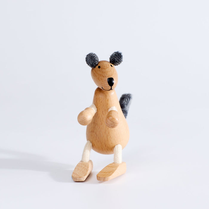 A wooden toy kangaroo with plush fabric and rope, standing upright on a white background.