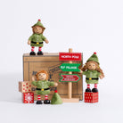 Three Cheeky Elves with their Christmas direction sign, wooden present blocks and gift box