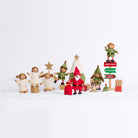 The complete Christmas Collection with three Cherub Angels, three Cheeky Elves, Santa, baby penguin, Christmas tree, sack, star stand, signpost and presents in a snowy scene